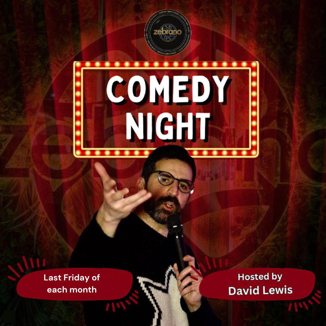 Image of comedian David Lewis holding a mic and pointing towards the camera, with COMEDY NIGHT in text behind, with lit-up surround. Last Friday of each month. Hosted by David Lewis. Zebrano logo