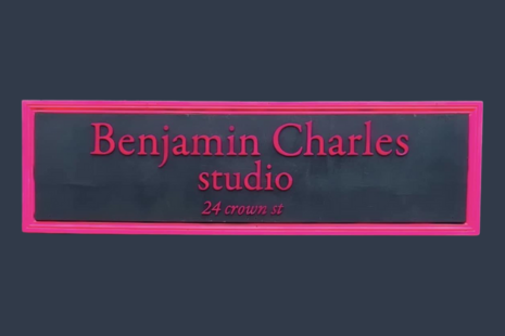 Image showing the black and pink sign of Benjamin Charles Studio at 24 Crown Street.