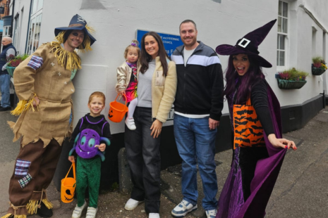 Image from Halloween 2024 showing a family with a scarecrow and witch character in Ingatestone.