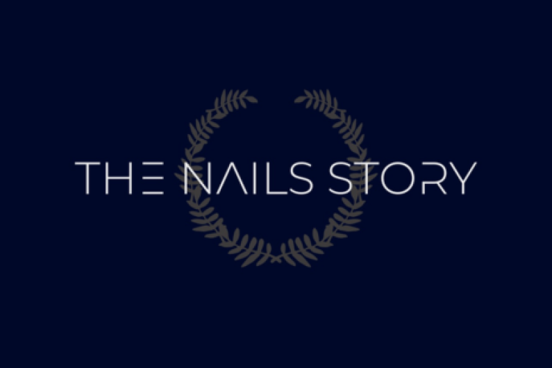 Logo for THE NAILS STORY with white text on a dark blue background.