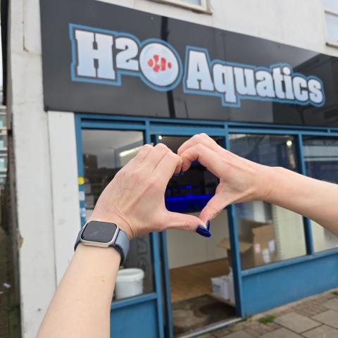 Image showing the front of H2O Aquatics with two hands forming a heart in front.