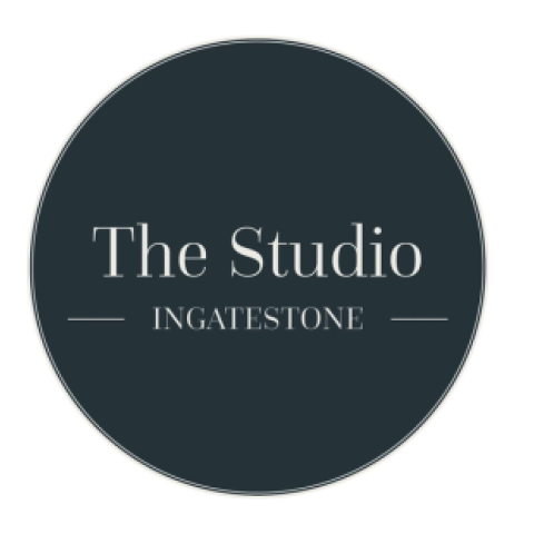Logo for The Studio Ingatestone, with white text on a dark grey circular background.
