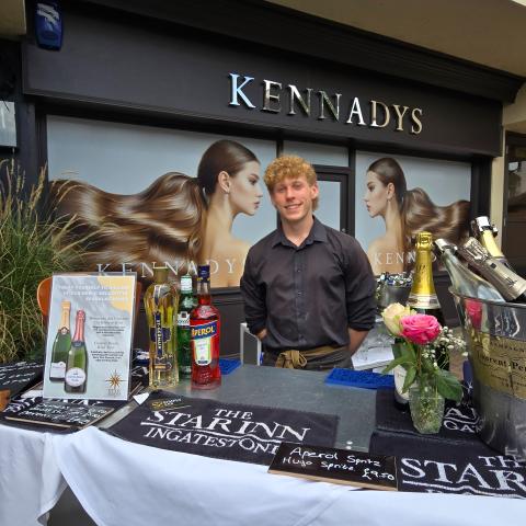 Image showing a member of staff from The Star Inn, operating a pop-up bar outside Kennadys.