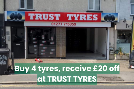 Image promoting a special offer from Trust Tyres. Image of the exterior of the business with text overlayed, reading 'Buy 4 tyres, receive £20 off' from Trust Tyres.