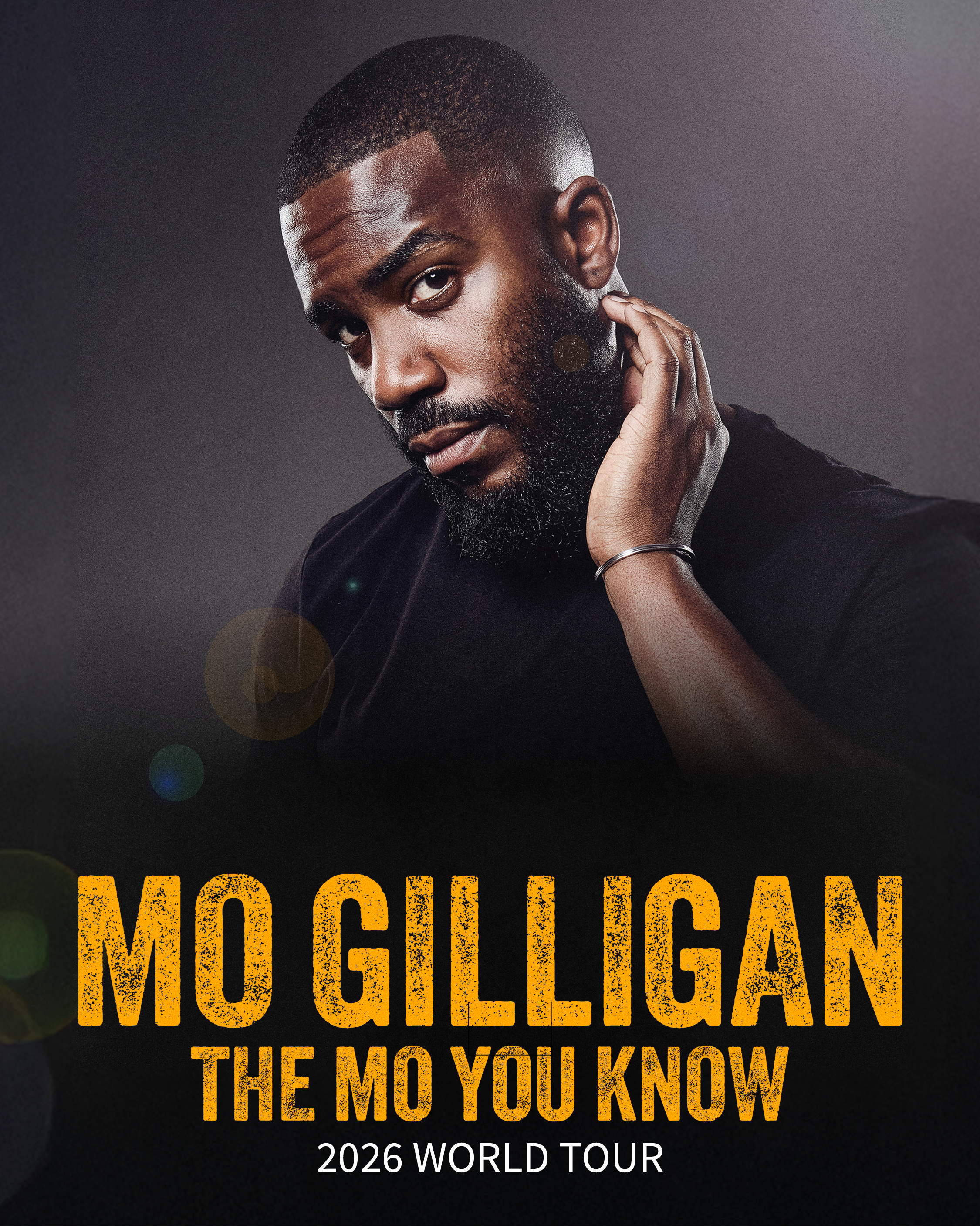 Comedian Mo Gilligan posing with hand on neck, text reads "Mo Gilligan: The Mo You Know 2024 World Tour".