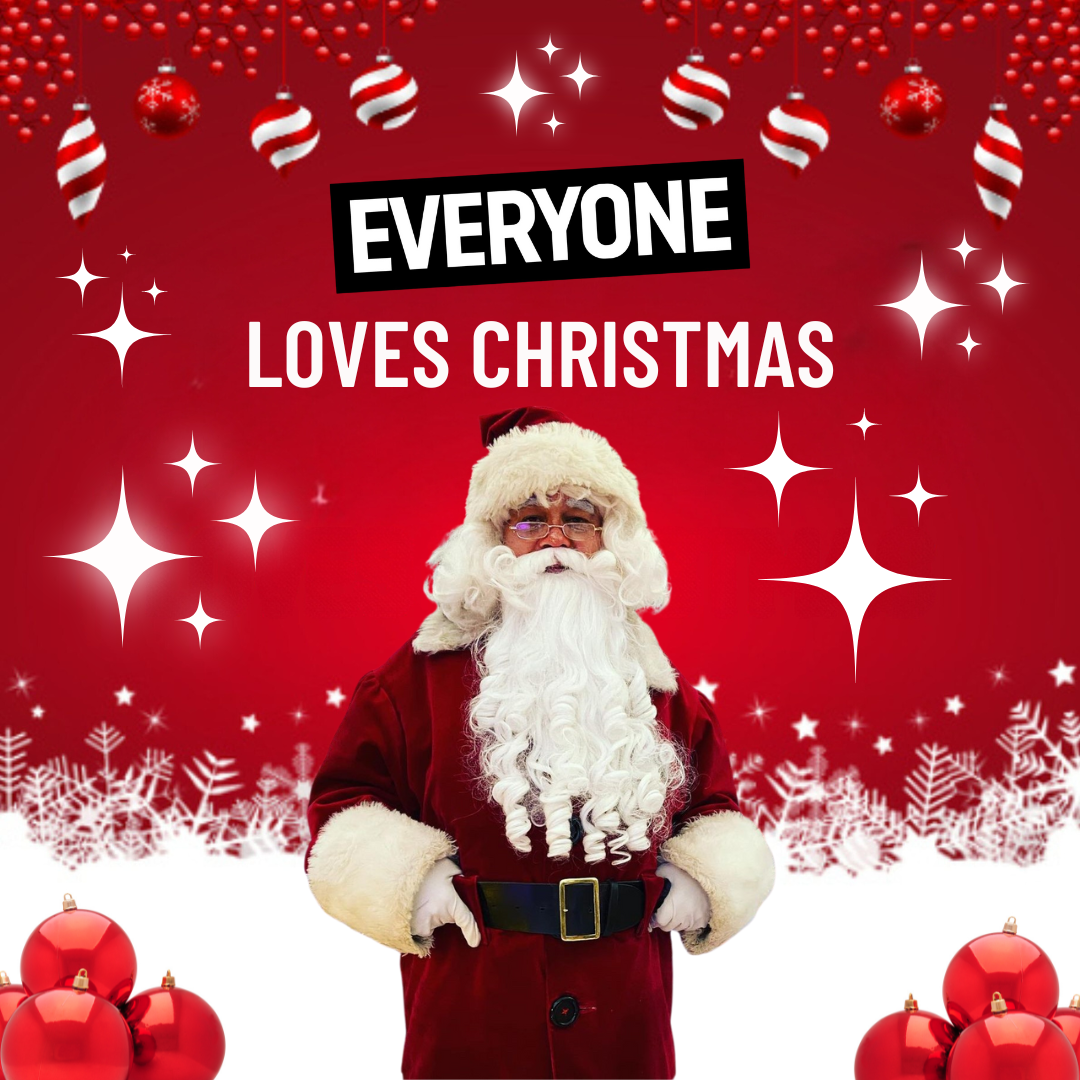 Festive Christmas-themed image featuring Santa Claus standing with hands on his belt. The background is bright red with hanging ornaments and snowflakes, along with white sparkling stars scattered throughout. The text 'EVERYONE LOVES CHRISTMAS' is prominently displayed above Santa in bold white letters, with 'EVERYONE' highlighted on a black background. Red Christmas baubles are placed at the bottom corners of the image.